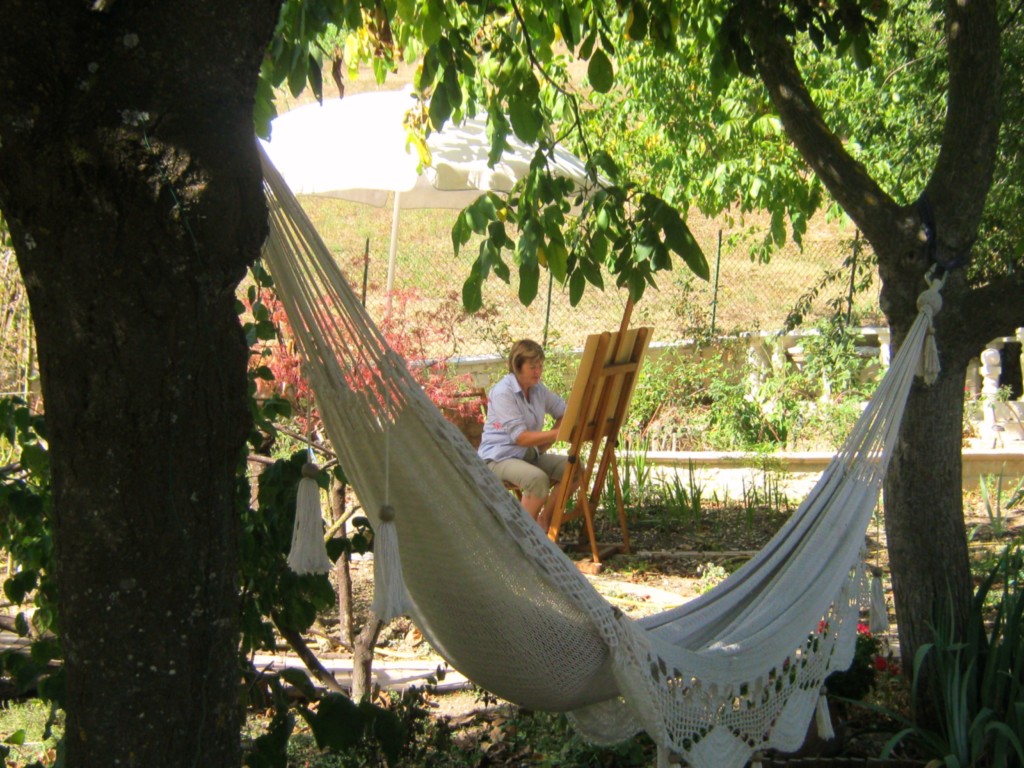 artist painting in garden